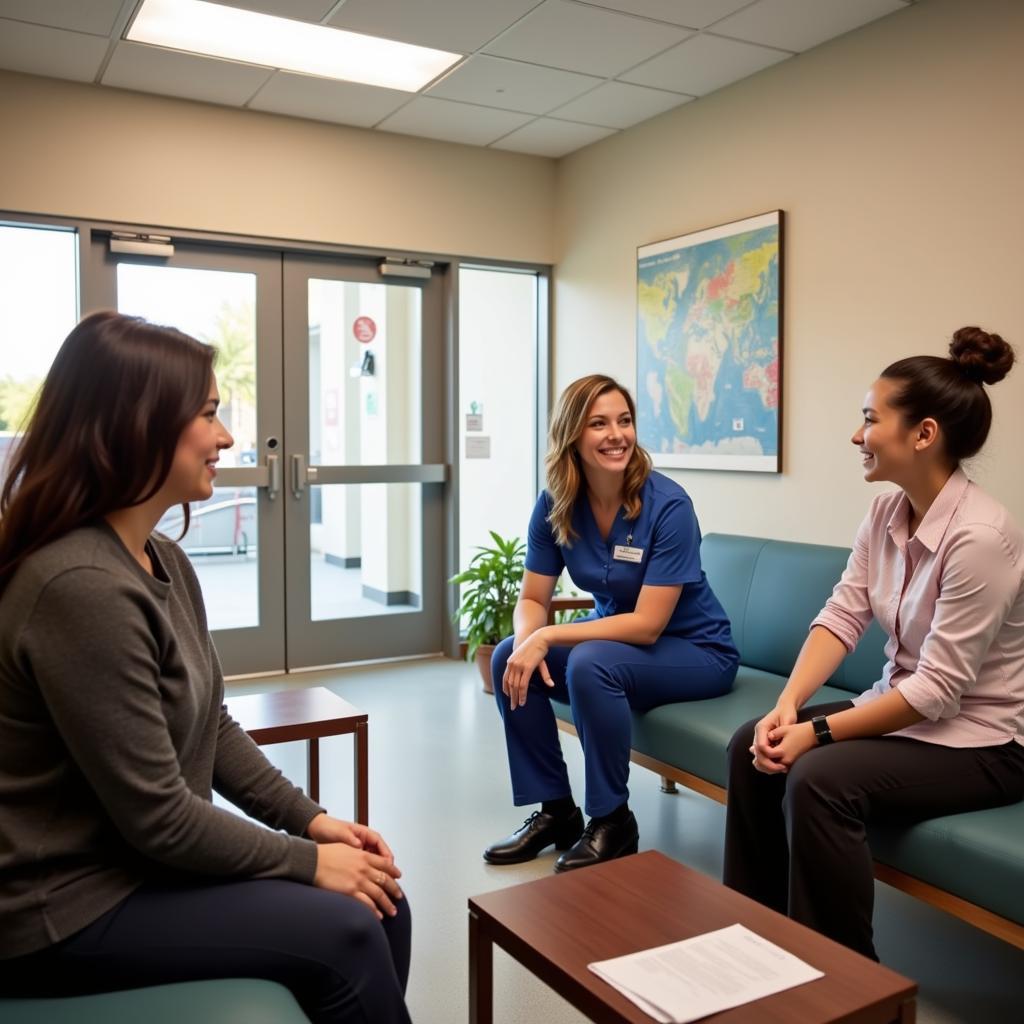 A patient and family member converse with a Clark Memorial Hospital staff member.