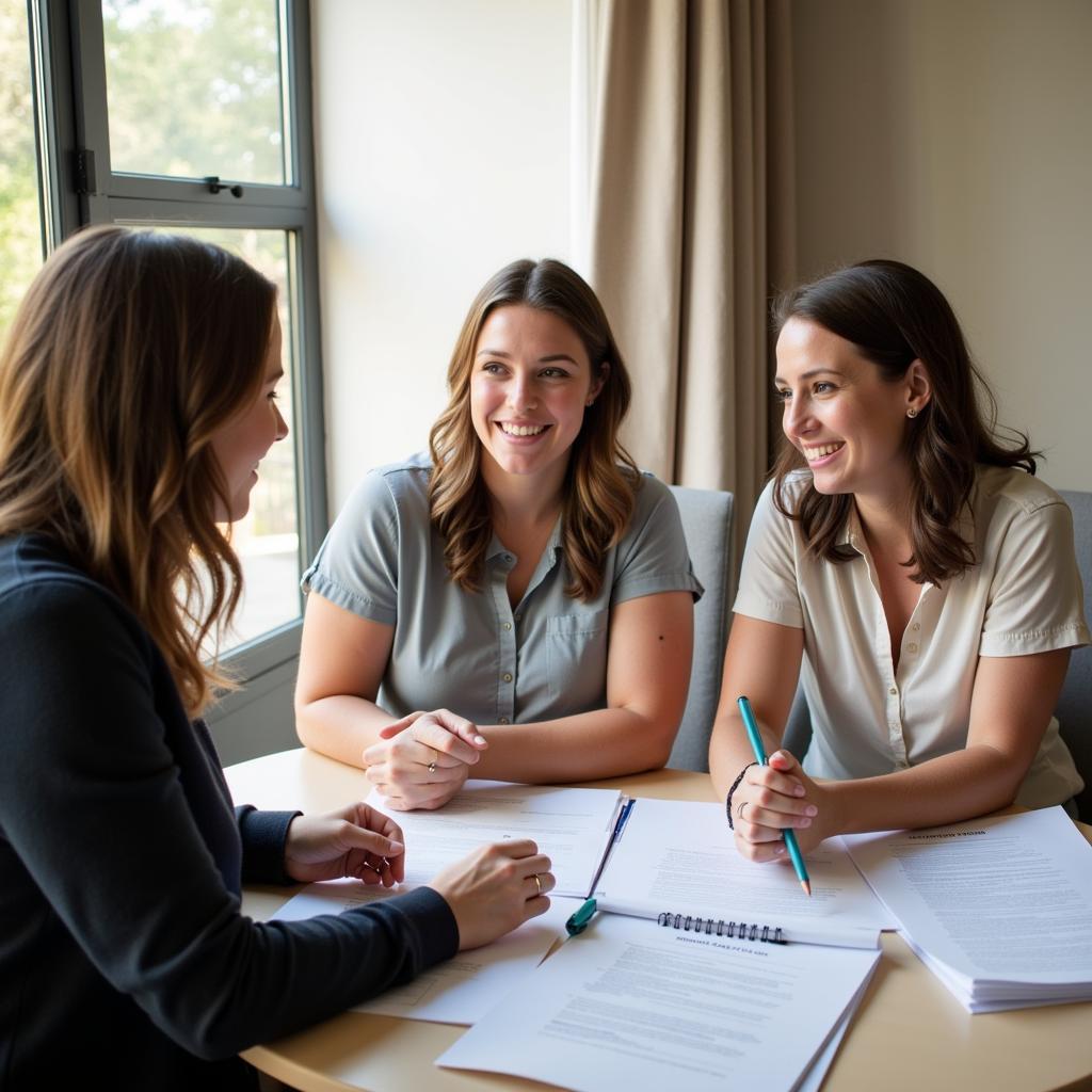 Couple discussing birth plan with their doula