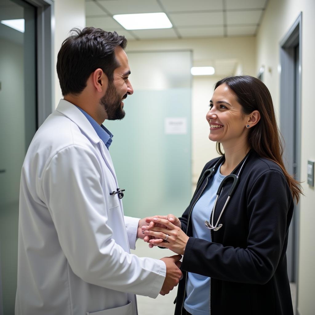 A doctor in Istanbul consults with a patient, both smiling.