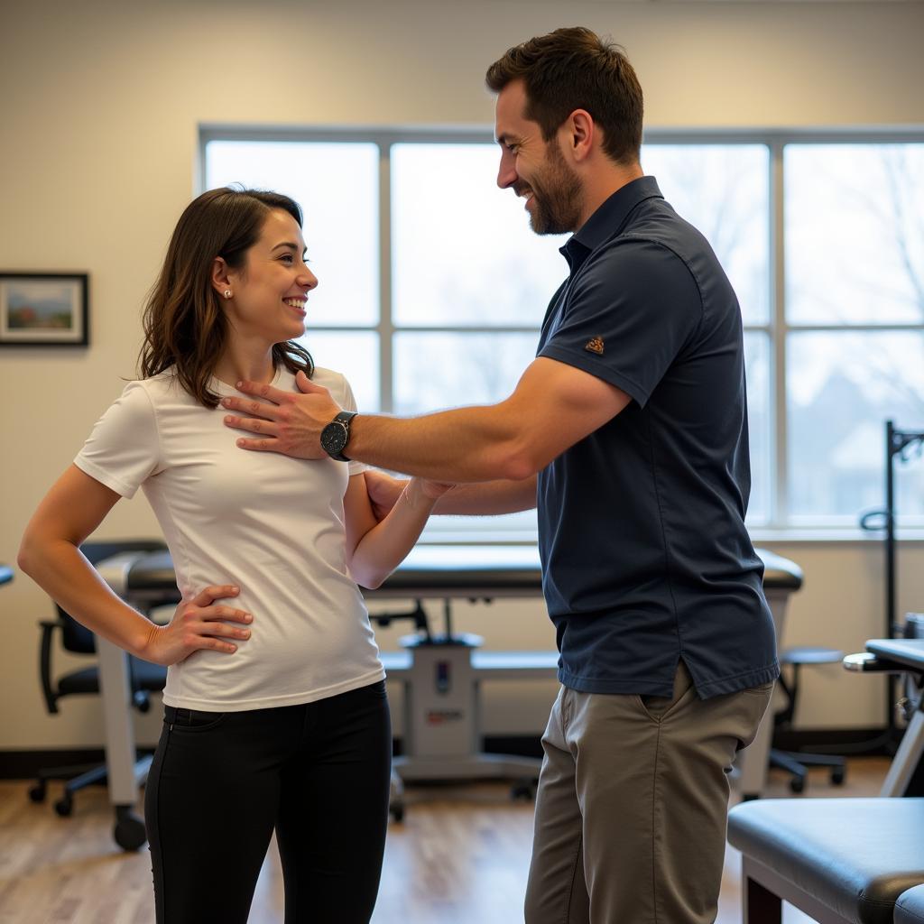 Physical Therapist working with a patient