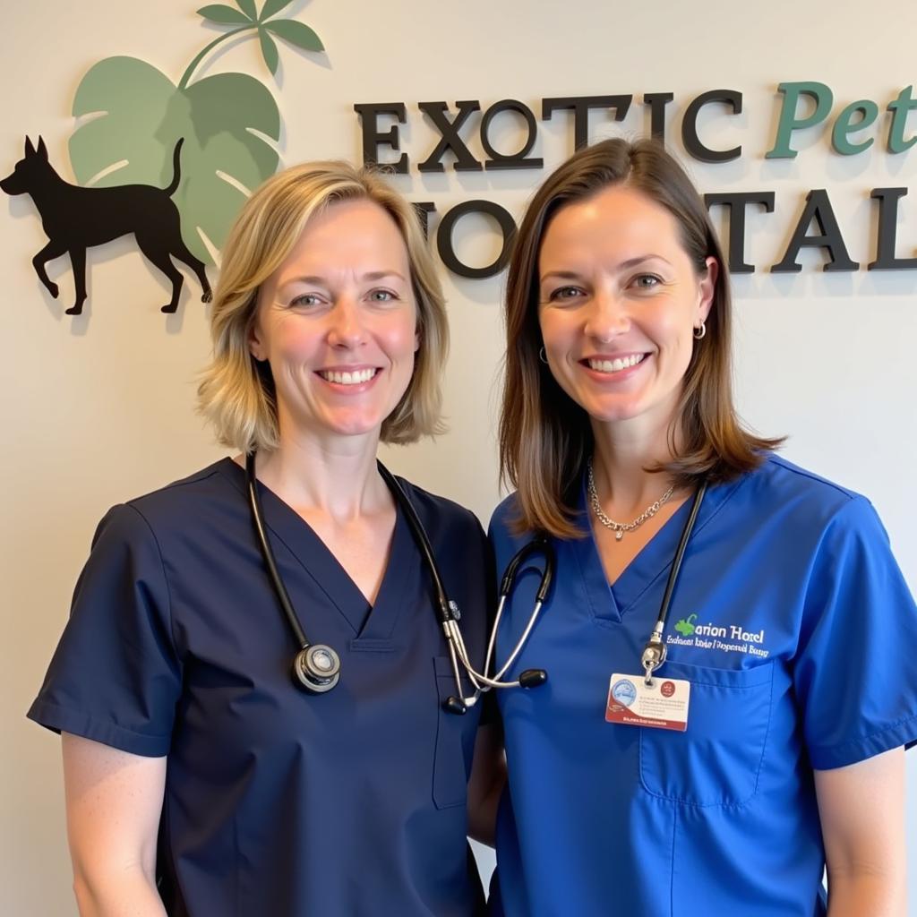 Veterinarian and veterinary technician smiling at the camera