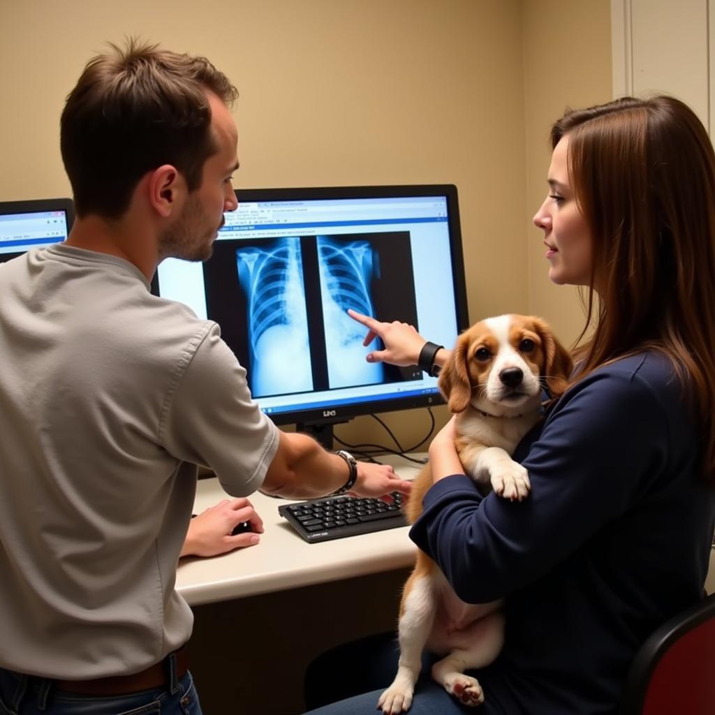 Veterinarian explaining x-ray to a dog owner in Corvallis