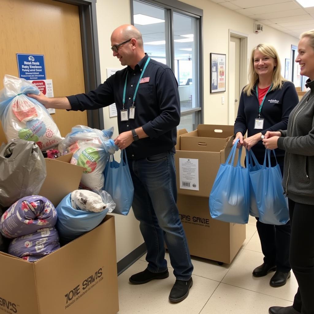 People donating bags of clothing and household items to a hospital thrift shop.