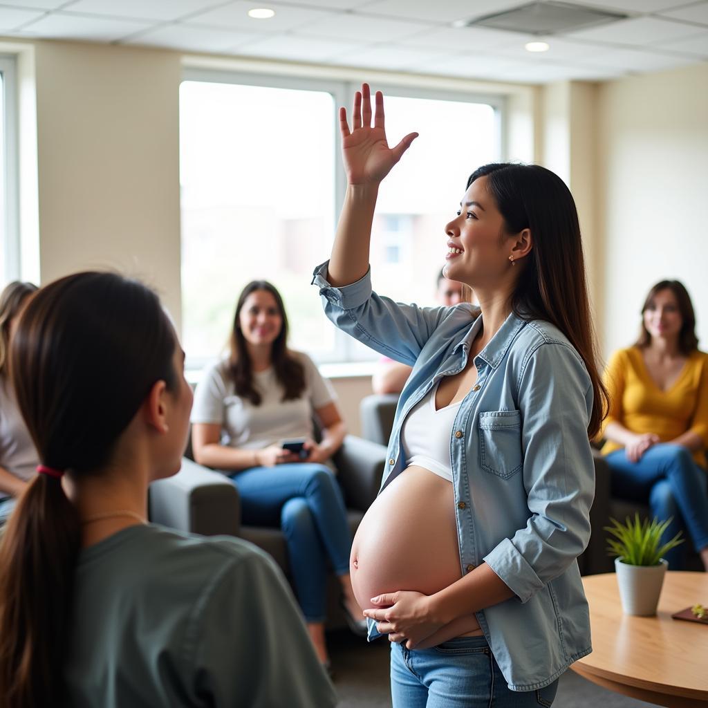 A pregnant woman actively engaging in a Q&A session during a hospital tour