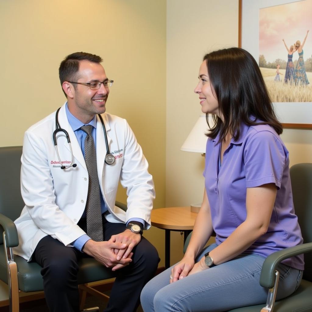 A doctor and patient discussing a treatment plan in a private consultation room at Wellstar Kennestone Cancer Center, demonstrating the personalized care offered.