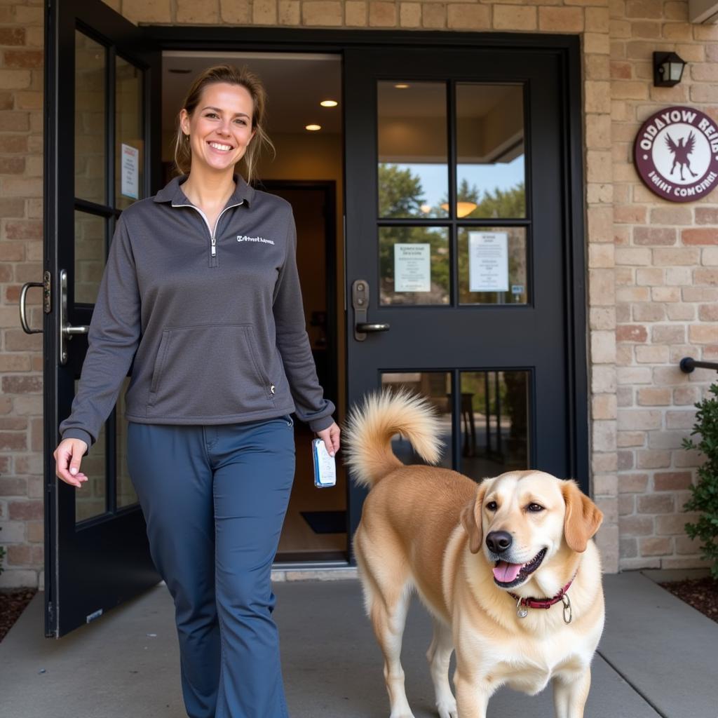 Happy Pet Owner Leaving Carthage Animal Hospital